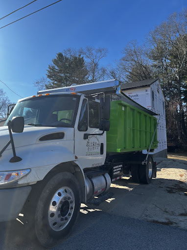 A dump truck parked on the side of the road